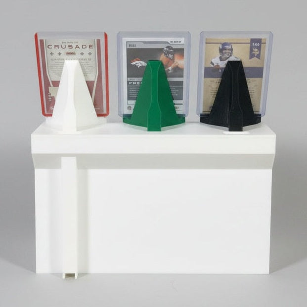 White card reader with multiple card slots on a dark surface