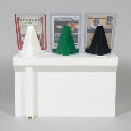 White card reader with multiple card slots on a dark surface