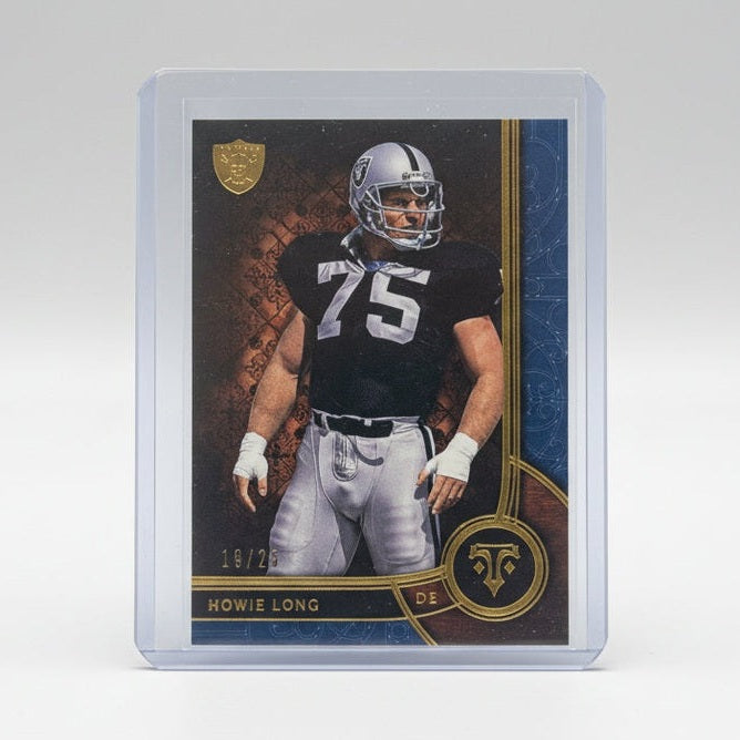 Football trading card of a player in a clear case on a dark surface