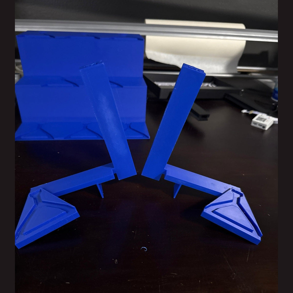 Blue 3D-printed model on a dark surface