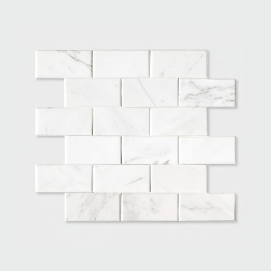White marble tiles arranged in a grid pattern on a white background