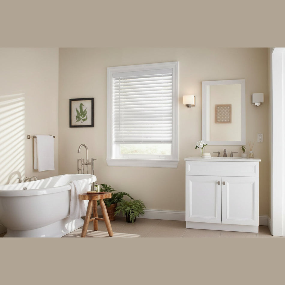 Bathroom interior with a window featuring white blinds, sink, and bathtub.