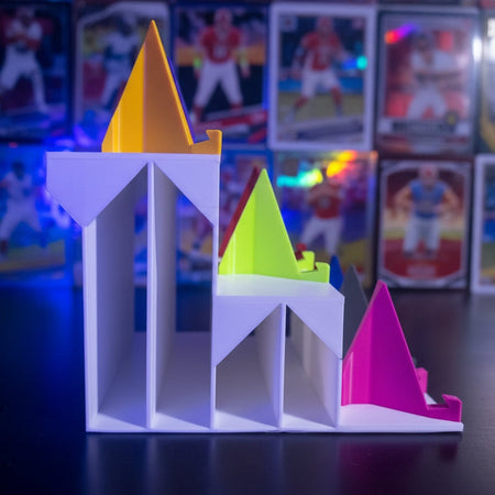 Colorful magnetic shelves attached to a refrigerator with various items on top.
