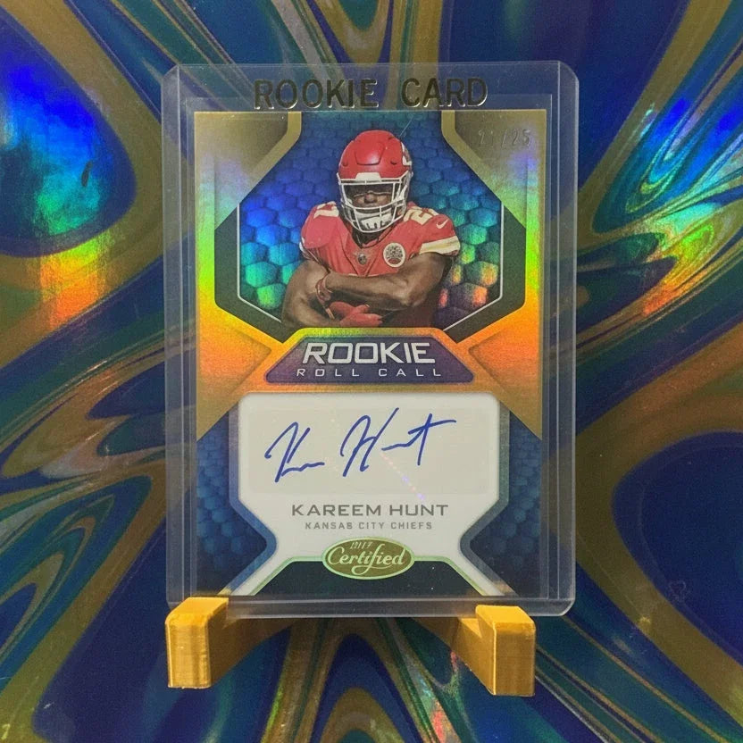 Autographed sports trading card in protective holder with colorful design