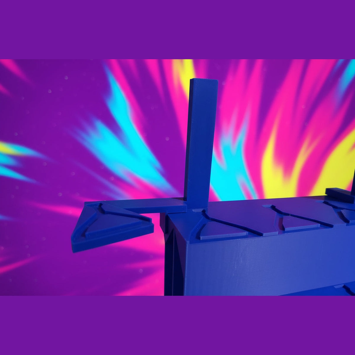 Close-up of a blue mechanical object with a dark background