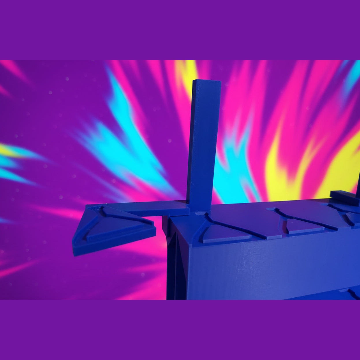 Close-up of a blue mechanical object with a dark background