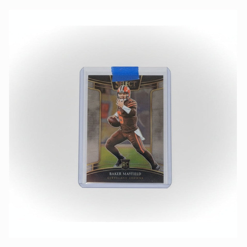Trading card in a protective holder on a dark surface