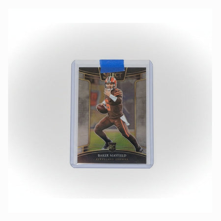 Trading card in a protective holder on a dark surface