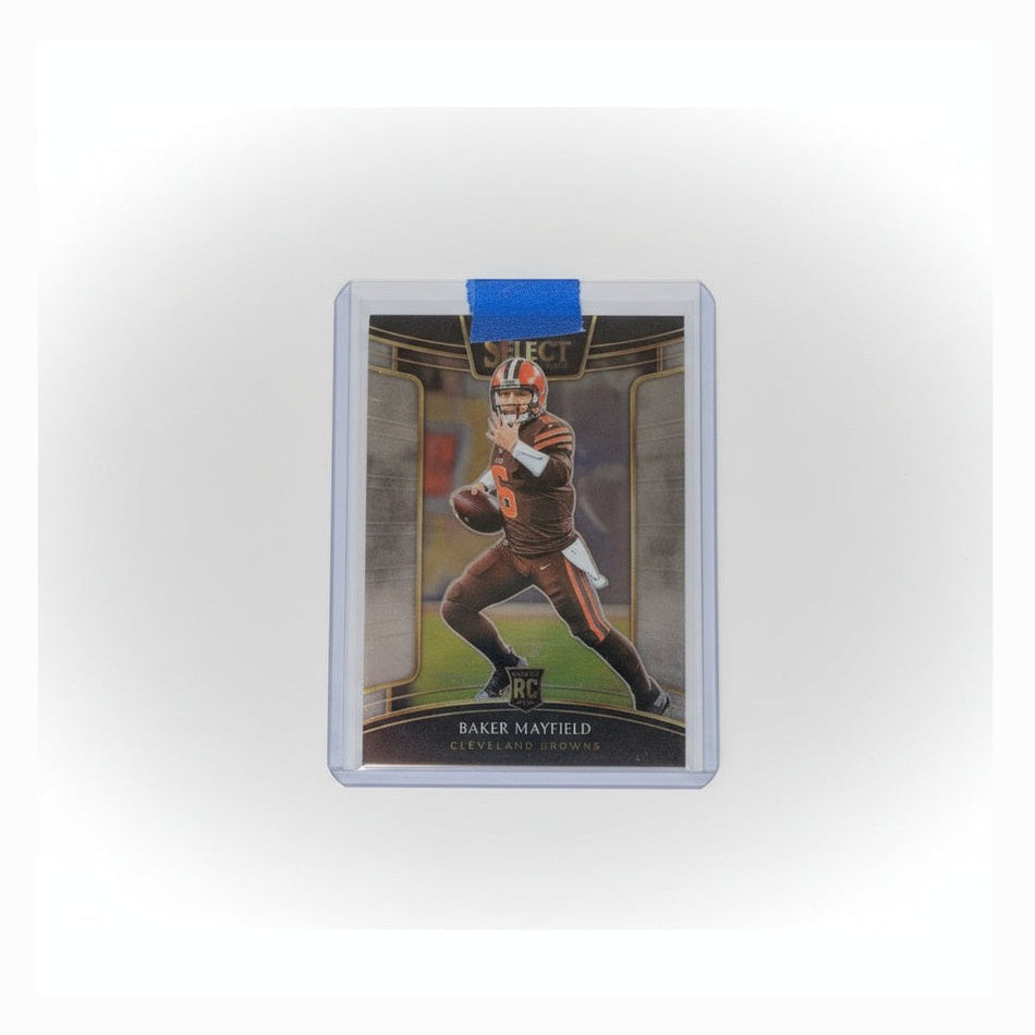 Trading card in a protective holder on a dark surface