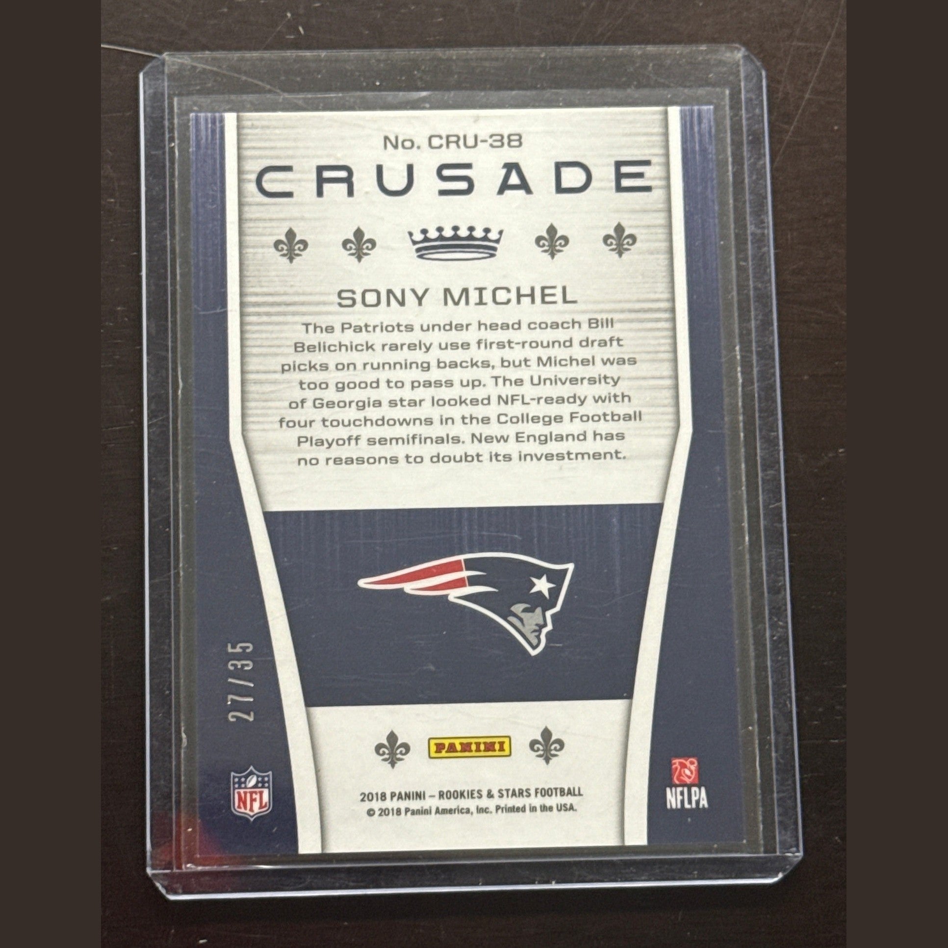Trading card of Sony Michel with Patriots logo on a dark background
