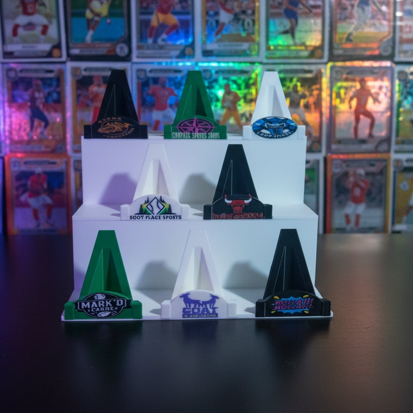 Model of a fighter jet on a white stand with various branding labels.