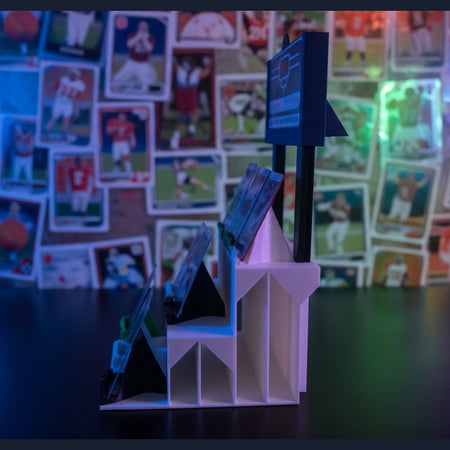 3D printer in operation with a partially printed object on a dark surface