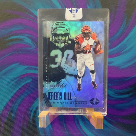 Football trading card of Jeremy Hill on a clear stand against a dark background