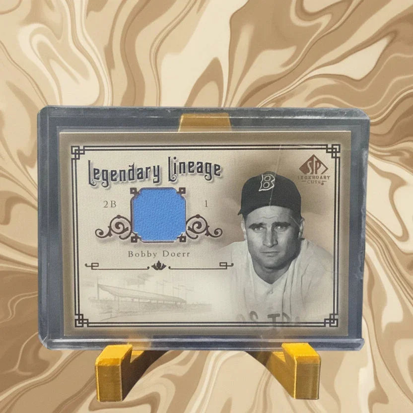Baseball trading card in protective case with 'Legendary Lineage' text