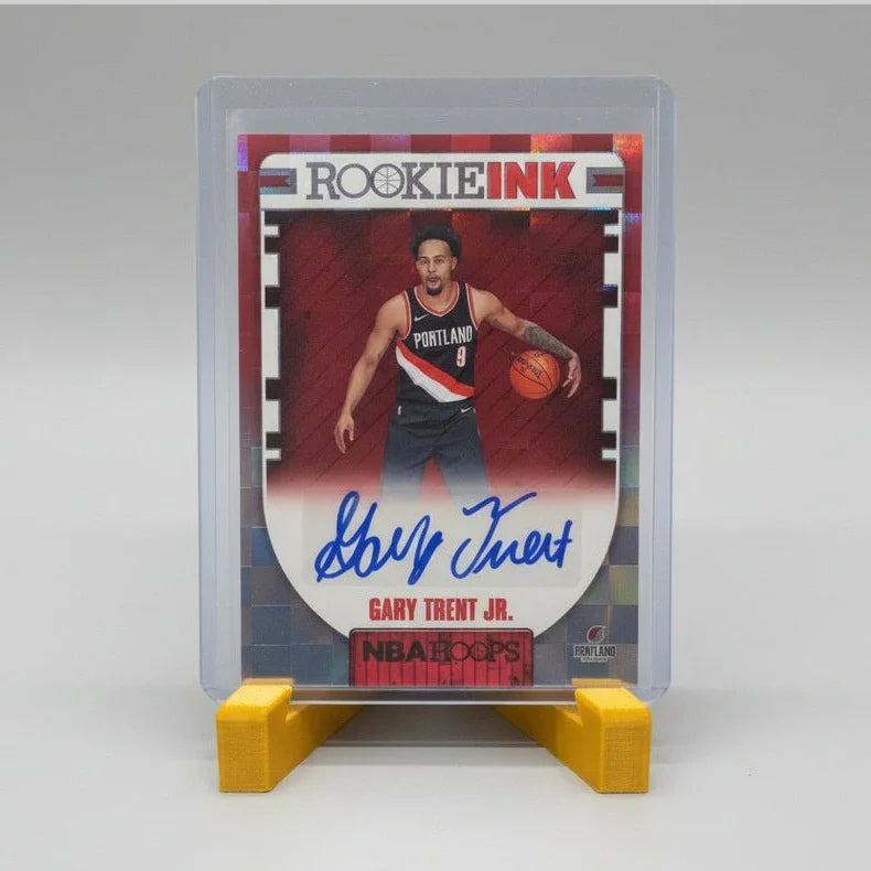 Basketball trading card in a protective case on a textured surface