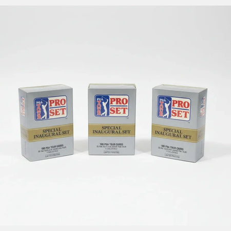 Three Pro Set trading card packs on a dark surface with a sports-themed poster in the background.