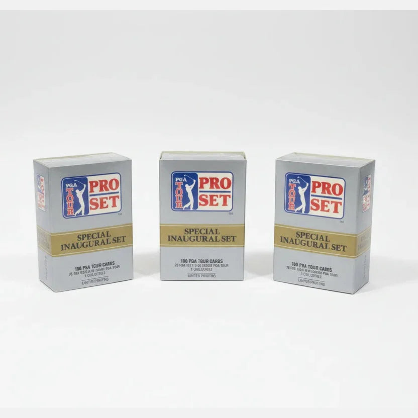 Three Pro Set trading card packs on a dark surface with a sports-themed poster in the background.