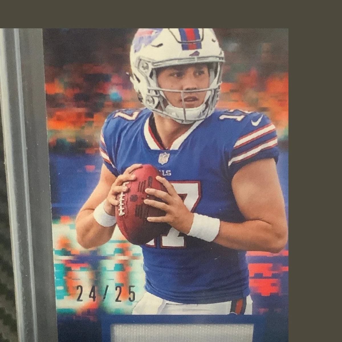 Football trading card with player in blue uniform holding helmet