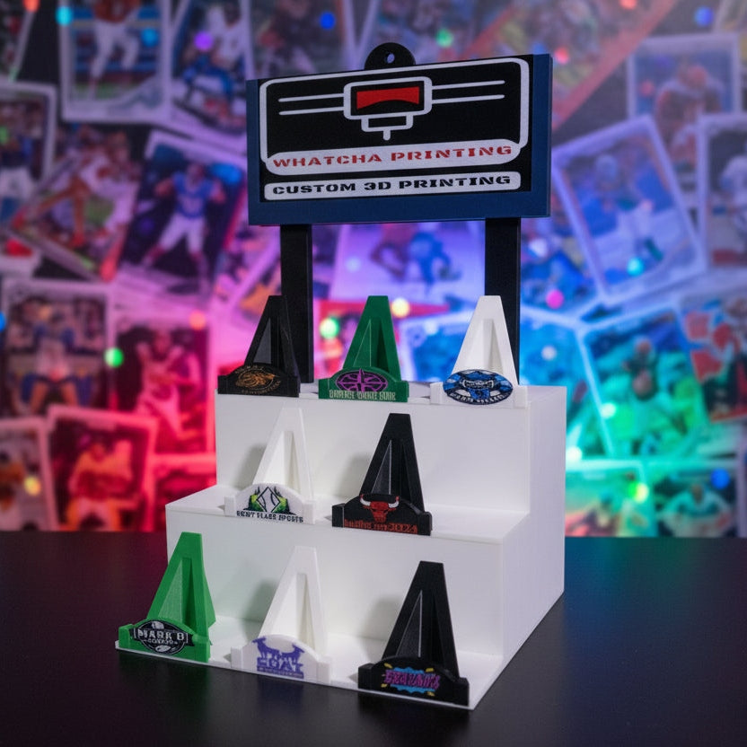 3D printed model of a vehicle with a printing company logo in the background