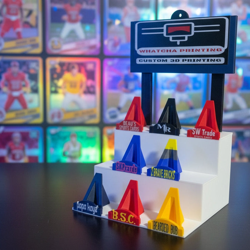 Colorful 3D printed objects on a display stand with branding labels.