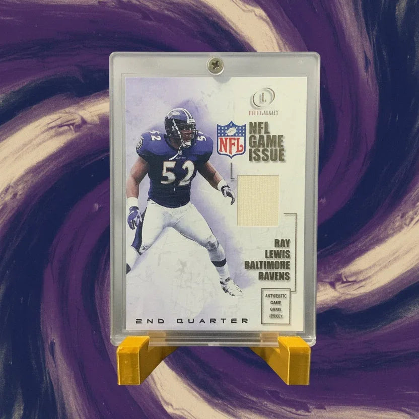 Football trading card in protective holder on a textured surface