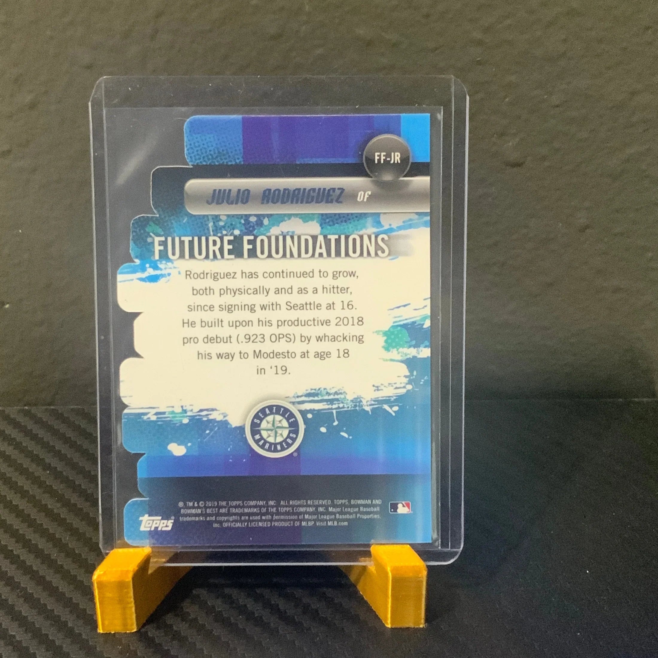 Baseball trading card featuring Julio Rodriguez on a dark textured background