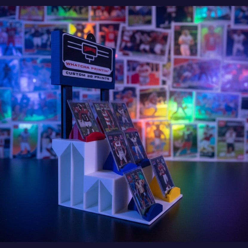 Model of a staircase with colorful steps against a dark wall