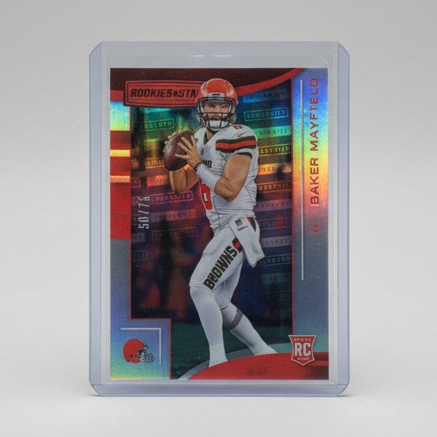 Trading card of a hockey player in a clear protective case on a dark surface