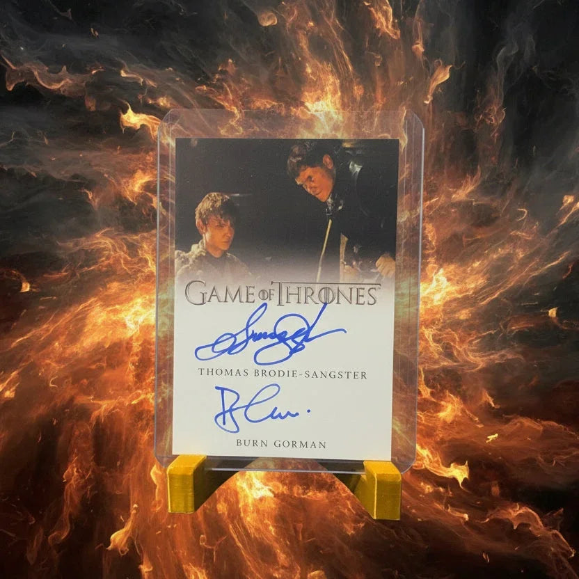 Trading card from 'Game of Thrones' with autographs on a textured surface