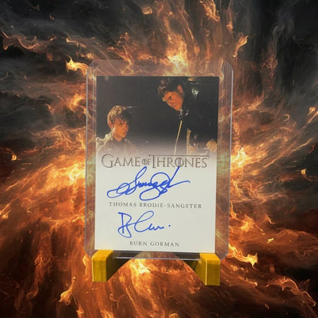 Trading card from 'Game of Thrones' with autographs on a textured surface