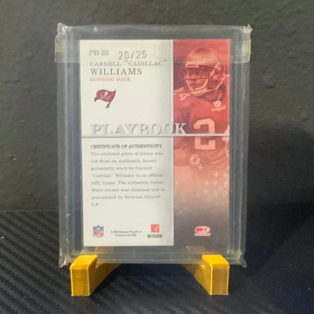 Trading card in a protective case on a textured surface