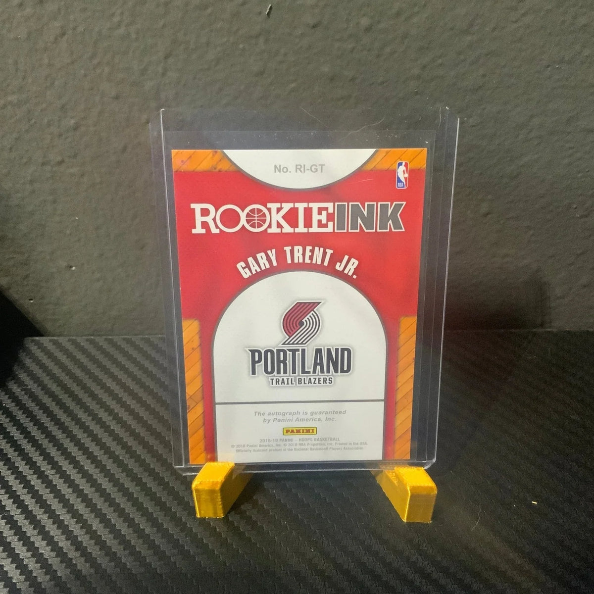 Trading card of Gary Trent Jr. with Portland Trail Blazers logo on a clear display stand.