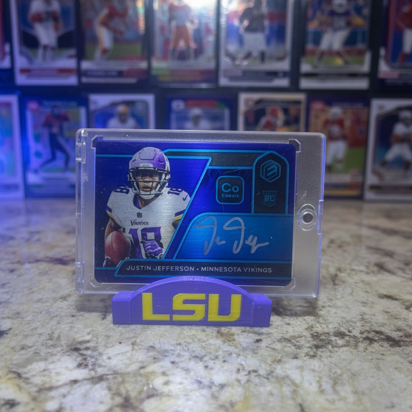 Trading card of a football player in a clear packaging on a marble surface