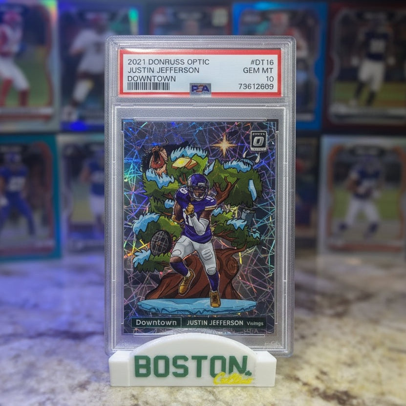 Trading card in protective packaging on a marble surface