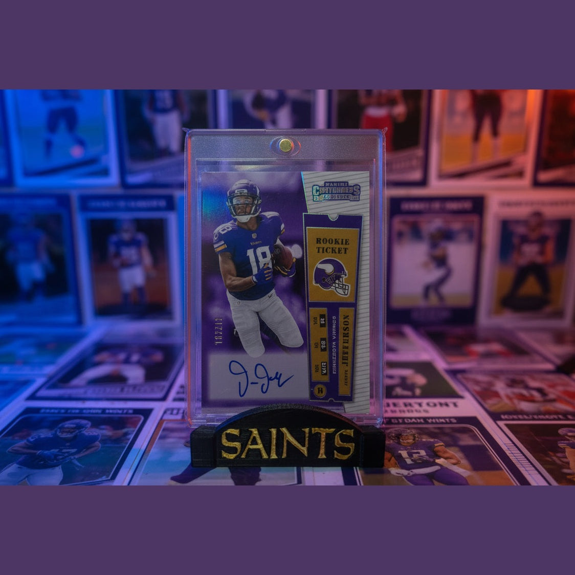 Football trading card with player image and 'Saints' branding on a background of other cards.