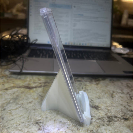 Clear plastic stand on a laptop on a marble surface
