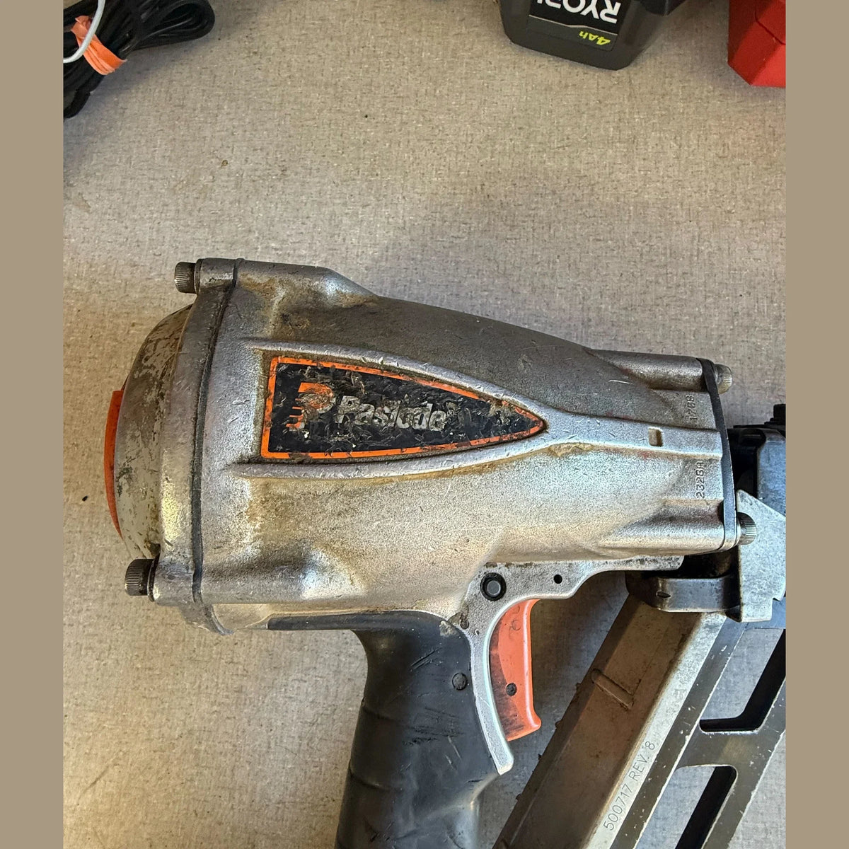 Metal tool with 'Pneumatic' branding on a beige surface