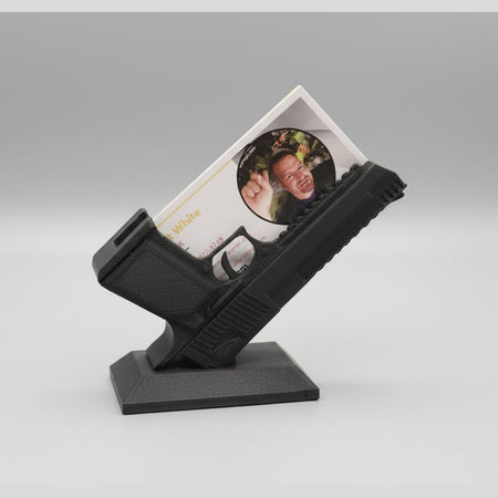 VHS tape with a picture of a person on it, placed on a stand.