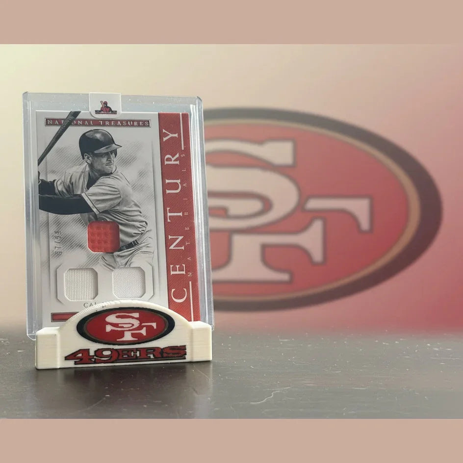 Baseball card in a clear holder with a San Francisco 49ers logo at the bottom.