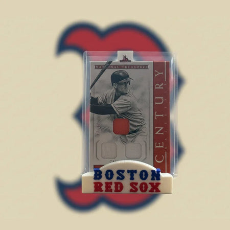 Baseball card of a player in a Boston Red Sox uniform with a clear holder.