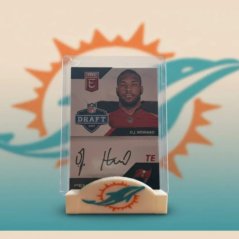 Trading card of O.J. Howard with a Miami Dolphins logo on a stand.