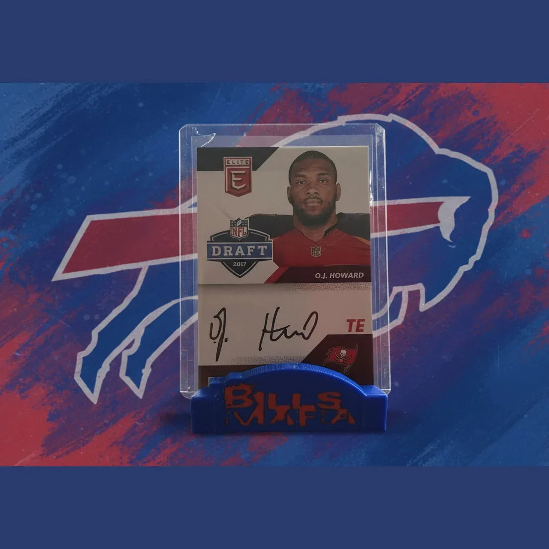 Trading card of O.J. Howard with a clear holder on a reflective surface