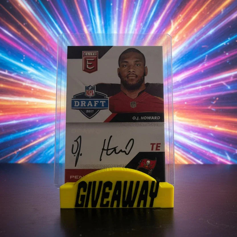 Trading card of O.J. Howard with a yellow holder labeled 'GIVEAWAY' on a reflective surface.