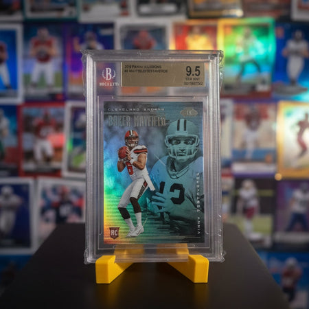 Football trading card in a protective case with a grading label on a dark surface.