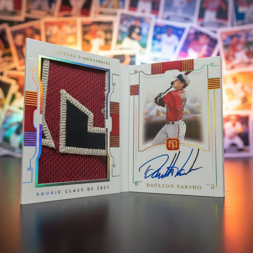 Baseball trading card with a player's signature on a dark surface