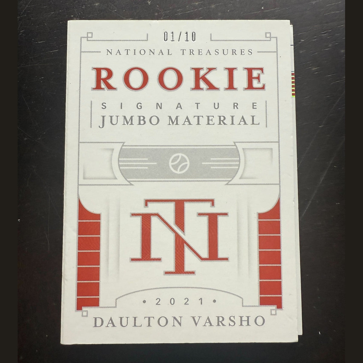 Card with 'National Treasures Rookie Signature Jumbo Material' text on a dark background