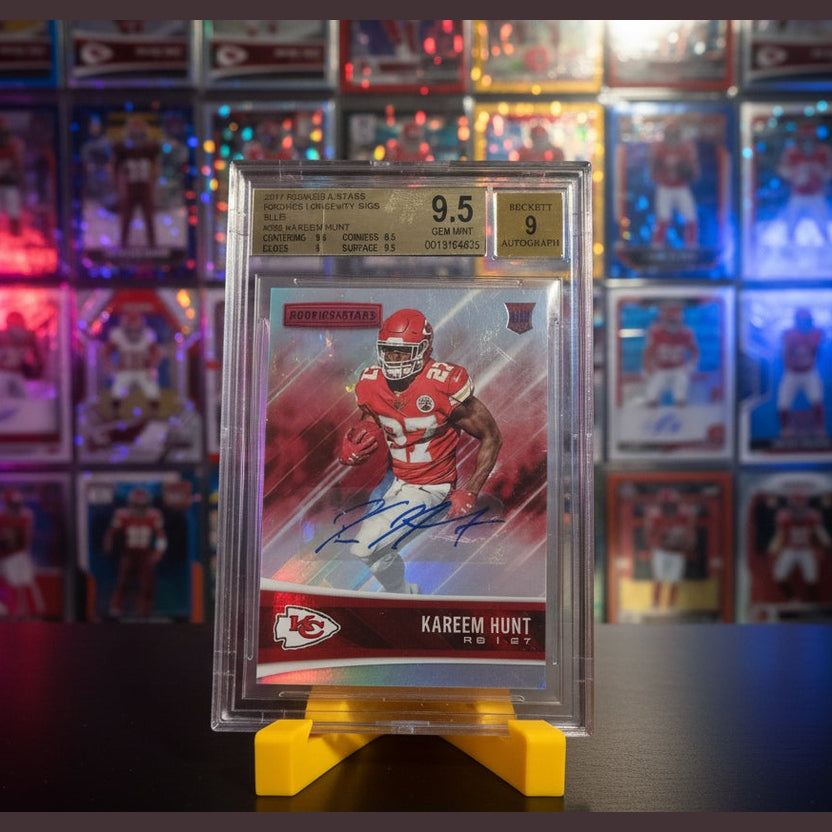Autographed football trading card of Kareem Hunt in a protective case with grading information.