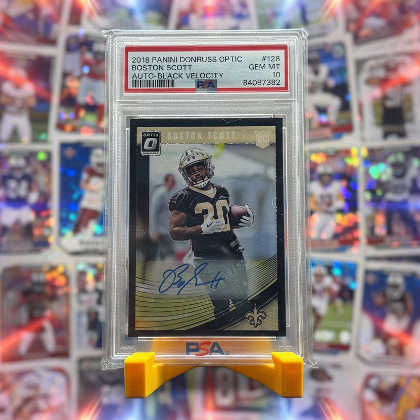 Football trading card in a protective case on a stand with a blurred background