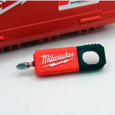 Red Milwaukee drill bit holder with a green handle on a white background