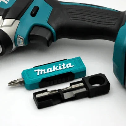 Makita cordless drill with additional drill bits on a white background